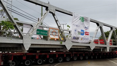 A Photo of the PBA Fern Isle (Ronald Regan Park) bridge being transported to the park.